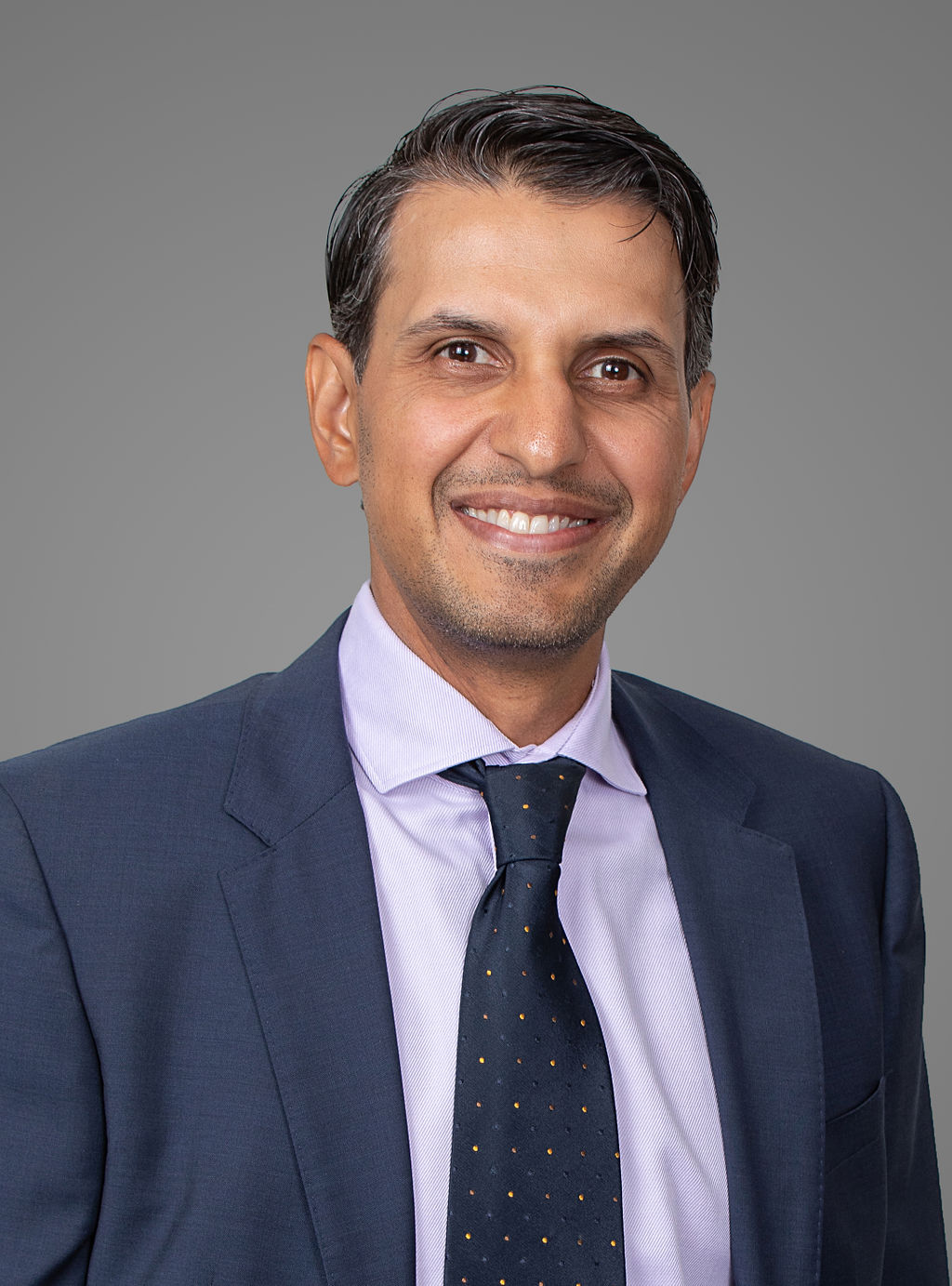 Mehendi Kamani headshot image. Partner and portfolio manager.